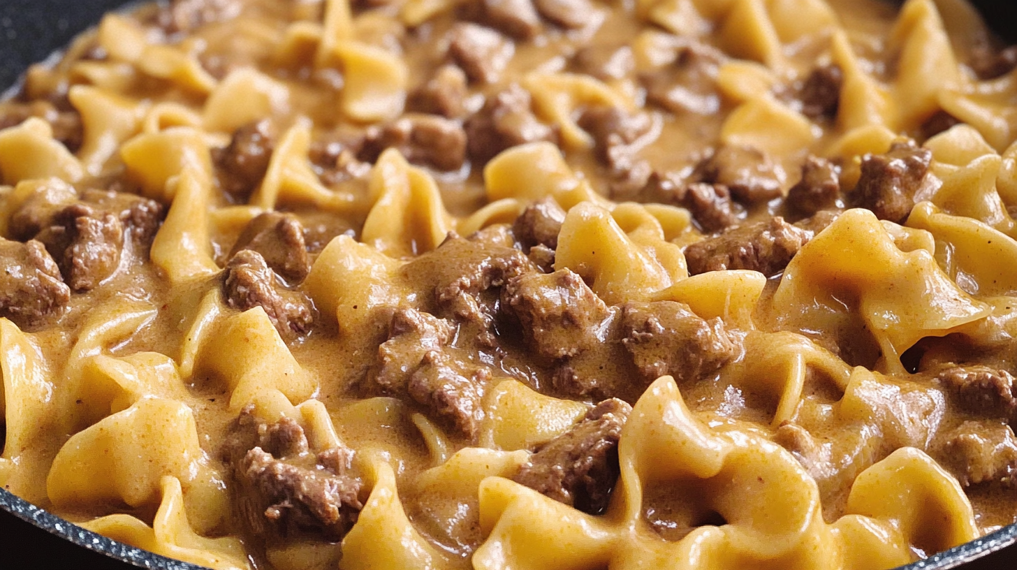 comforting bowl of Hamburger Helper Beef Stroganoff with creamy sauce, tender noodles, and ground beef, served with parsley garnish on a rustic table.